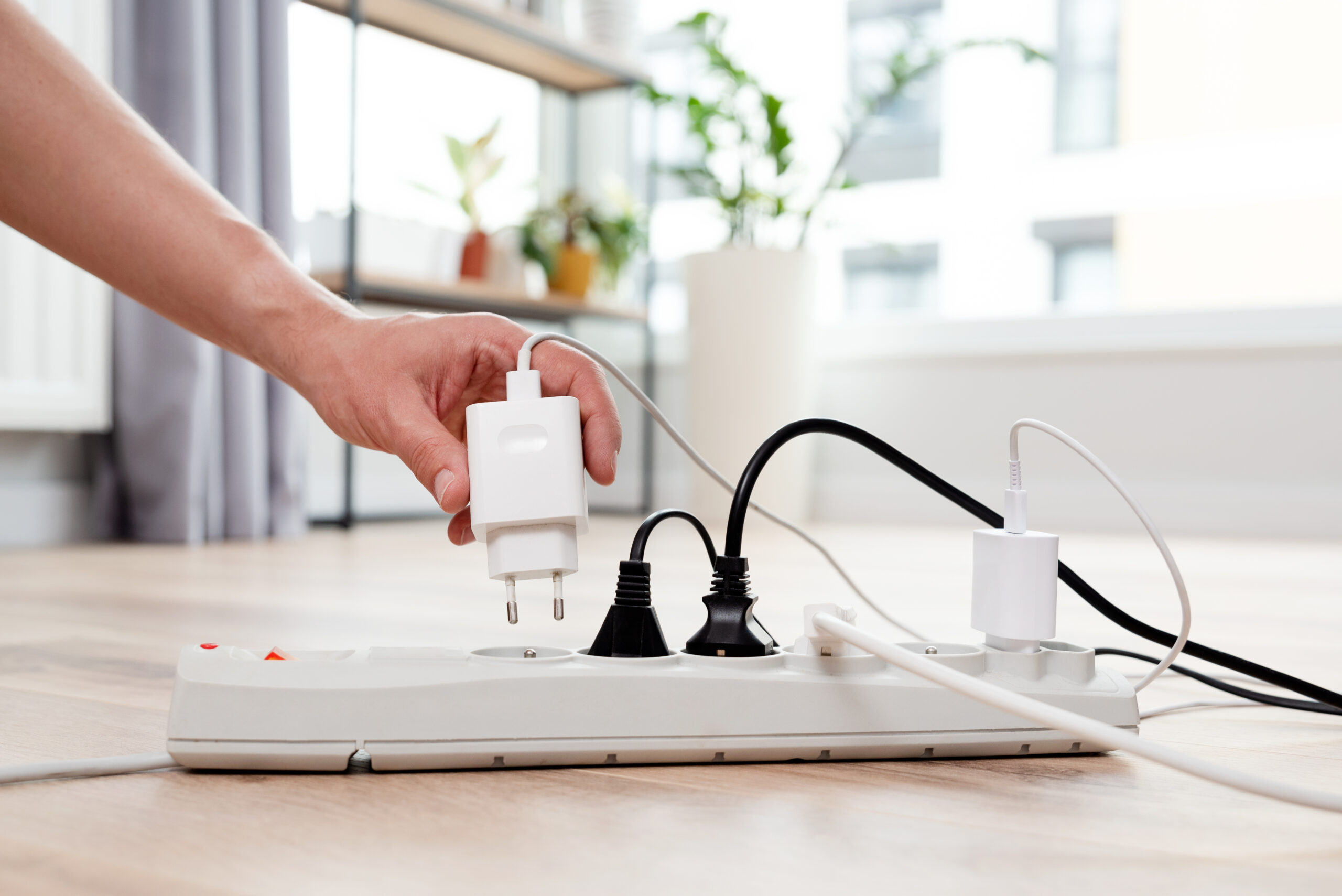 Electrical plug in outlet socket at home
